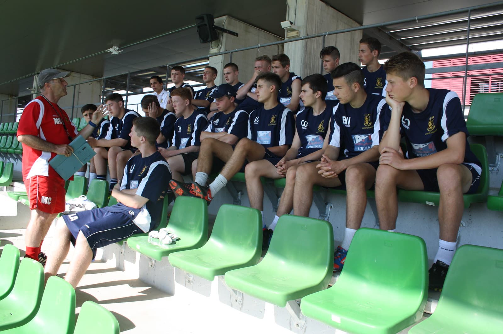 Youth soccer team listening to coaching instructions at Spanish FA facilities