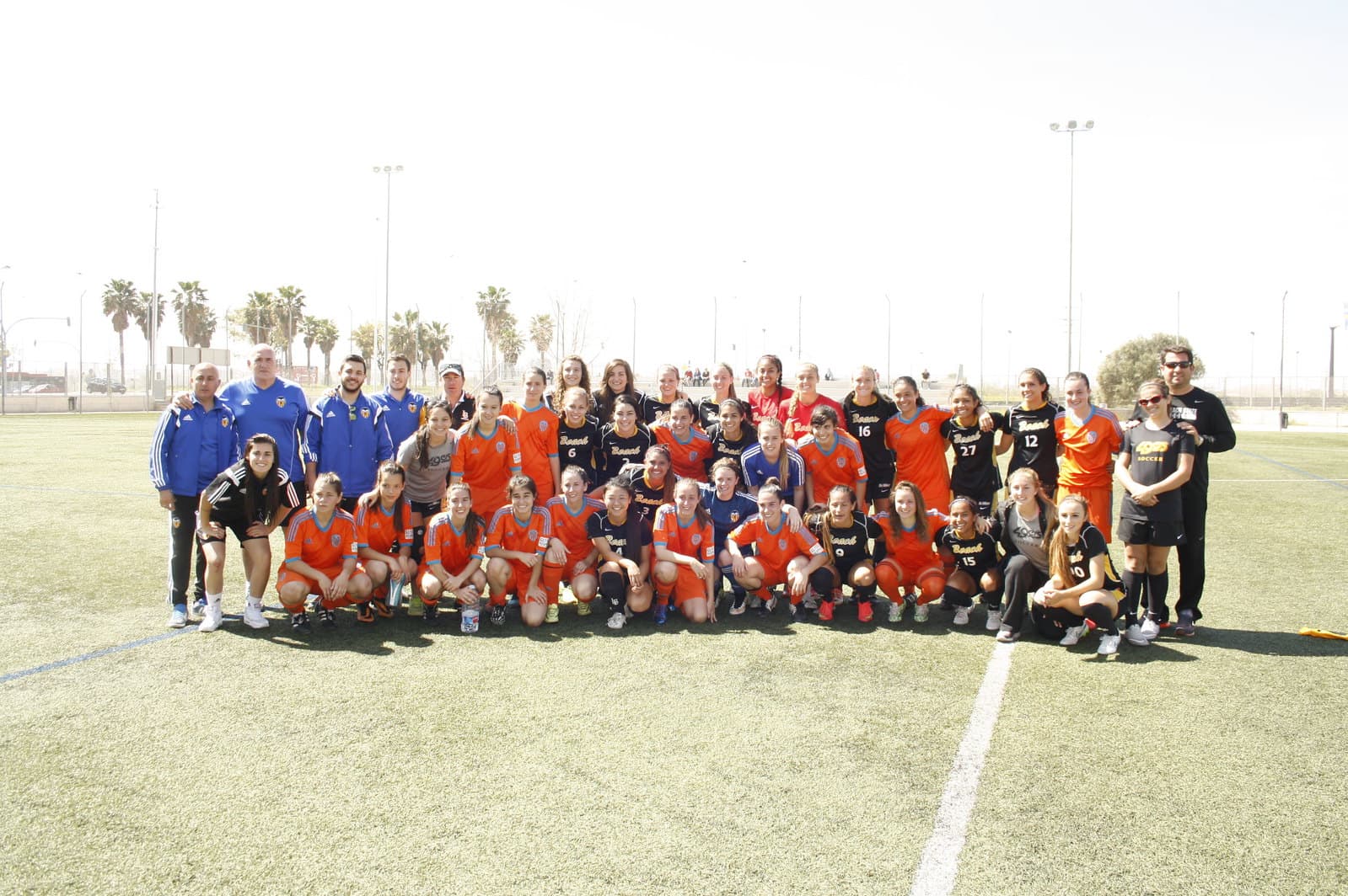 Youth soccer teams together after a friendly match in Spain